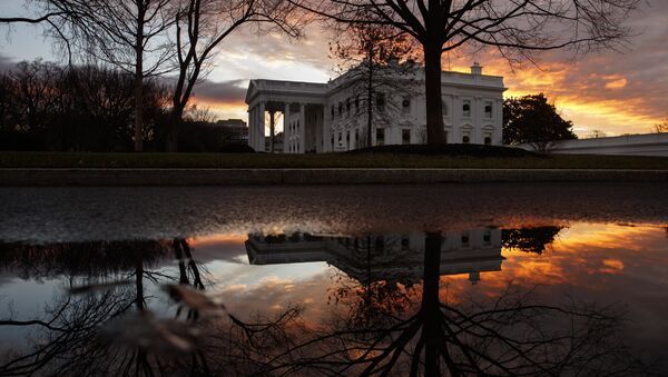 The sun rises behind the White House in Washington, Saturday, Dec. 22, 2018. Hundreds of thousands of federal workers faced a partial government shutdown early Saturday after Democrats refused to meet President Donald Trump's demands for $5 billion to start erecting a border wall with Mexico - Sputnik International
