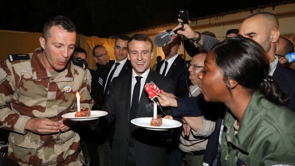 French President Emmanuel Macron celebrates the birthdays of two French soldiers including Nana (22) of Mali, from the Barkhane force during a dinner at the Barkhane tactical command center in N'Djamena on December 22, 2018. - Sputnik International