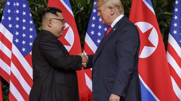 U.S. President Donald Trump shakes hands with North Korea leader Kim Jong Un at the Capella resort on Sentosa Island Tuesday, June 12, 2018 in Singapore. - Sputnik International