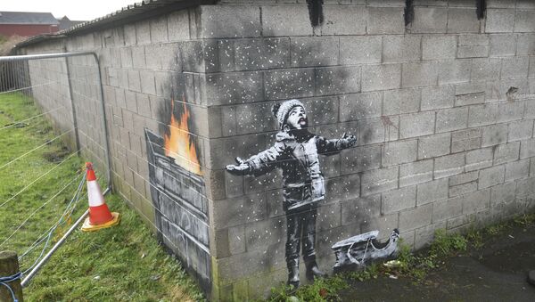 Artwork by street artist Banksy, Thursday Dec. 20, 2018, which appeared on a garage wall in Taibach, Port Talbot, south Wales. Street artist and social commentator Banksy has apparently popped up in Wales, leaving a new artwork on a garage in Port Talbot that references the town's air pollution. - Sputnik International