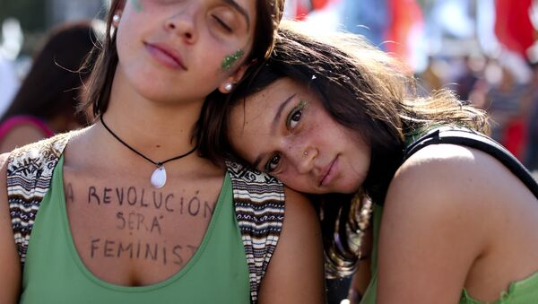 A woman wears a message on her chest that reads in Spanish: The revolution is feminist during a demonstration celebrating International Women's Day, in Buenos Aires, Argentina, Thursday, March 8, 2018 - Sputnik International