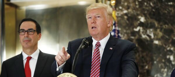 President Donald Trump, accompanied by Treasury Secretary Steven Mnuchin, speaks to the media in the lobby of Trump Tower in New York, Tuesday, Aug. 15, 2017 - Sputnik International