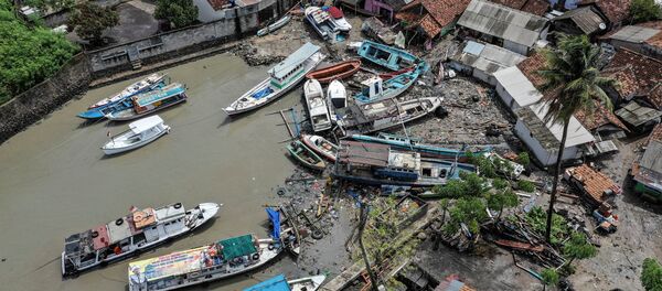 Stranded boats are seen near houses after a tsunami hit at Anyer in Banten, Indonesia, December 24, 2018 in this photo taken by Antara Foto - Sputnik International