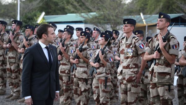 French president Emmanuel Macron reviews the troops as he arrives at the Barkhane tactical command center of the Barkhane force in N'Djamena on December 22, 2018. French president is on visit to meet with Chadian president and with soldiers from the Barkhane mission in Africa's Sahel region. - Sputnik International