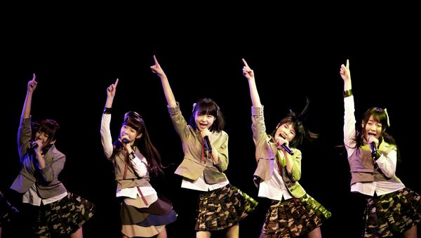 In this photo taken Saturday, Jan. 12, 2013, members of SNH48, a Shanghai-based Chinese girls group, perform during their first appearance on stage in Shanghai, China. They are a newly-launched sister group of Tokyo-based AKB48 - Sputnik International