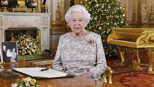 In this photo released on Monday, Dec. 24, 2018, Queen Elizabeth II poses after she recorded her annual Christmas Day message, in the White Drawing Room of Buckingham Palace in central London - Sputnik International