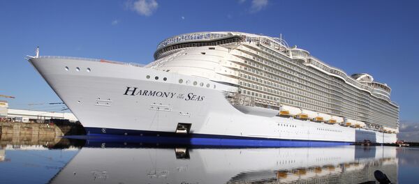 In this Feb. 18, 2016 file photo, the Harmony of the Seas docks at the STX Shipyard in Saint-Nazaire, western France. Tens of thousands of French well-wishers waved revoir to the largest cruise ship in the world as it set sail on its maiden voyage to the U.K. after 32 months in a French shipyard. In this Feb. 18, 2016 file photo, the Harmony of the Seas docks at the STX Shipyard in Saint-Nazaire, western France. Tens of thousands of French well-wishers waved revoir to the largest cruise ship in the world as it set sail on its maiden voyage to the U.K. after 32 months in a French shipyard. - Sputnik International