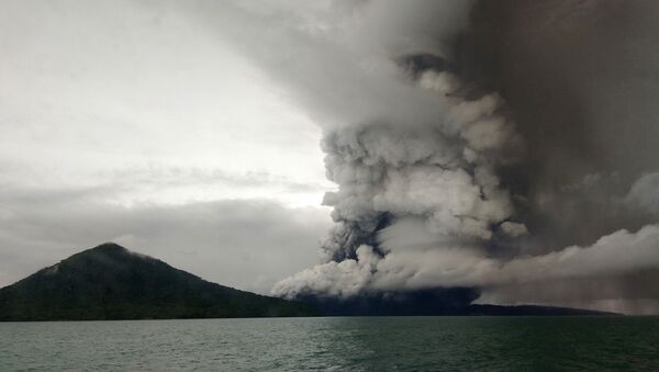 This picture taken on December 26, 2018 shows the Anak (Child) Krakatoa volcano erupting, as seen from a ship on the Sunda Straits. Indonesia on December 27 raised the danger alert level for a volcano that sparked a killer tsunami, after previously warning that fresh activity at the crater threatened to launch another deadly wave - Sputnik International