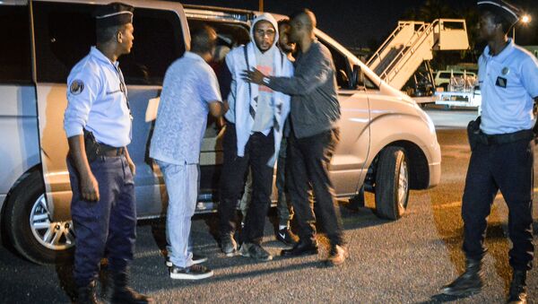 French national Peter Cherif (C) alleged associate of the Kouachi brothers, perpetrators of 2015 Charlie Hebdo attack, steps out a car as he is extradited to France at Djibouti International Airport in Djibouti on December 22, 2018 - Sputnik International