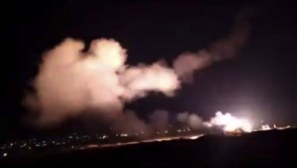 This frame grab from a video provided by the Syrian official news agency SANA shows missiles flying into the sky near Damascus, Syria, Tuesday, Dec. 25, 2018 - Sputnik International