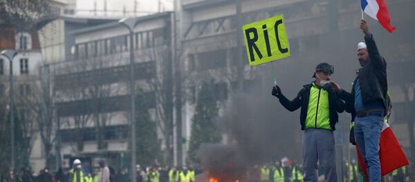 Protesters wearing yellow vests attend a demonstration of the yellow vests movement in Nantes, France, December 22, 2018 Protesters wearing yellow vests attend a demonstration of the yellow vests movement in Nantes, France, December 22, 2018 - Sputnik International