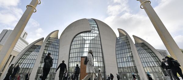 FILE - In this Oct. 3, 2017 file photo people stand outside the new central DITIB mosque on the Day of Open Mosques in Cologne. The controversial new mosque by the organization of Turkish-Islamic Union for Religious Affairs is the largest mosque in Germany FILE - In this Oct. 3, 2017 file photo people stand outside the new central DITIB mosque on the Day of Open Mosques in Cologne. The controversial new mosque by the organization of Turkish-Islamic Union for Religious Affairs is the largest mosque in Germany - Sputnik International