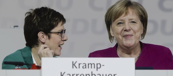 German Chancellor Angela Merkel, right, talks with CDU party chairwoman Annegret Kramp-Karrenbauer, left, during a party convention of the Christian Democratic Party CDU in Hamburg, Germany, Saturday, Dec. 8, 2018 German Chancellor Angela Merkel, right, talks with CDU party chairwoman Annegret Kramp-Karrenbauer, left, during a party convention of the Christian Democratic Party CDU in Hamburg, Germany, Saturday, Dec. 8, 2018 - Sputnik International