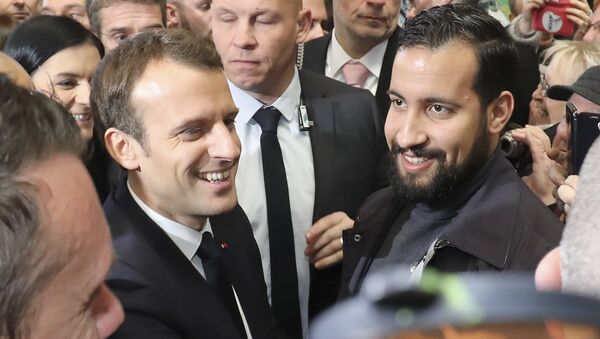 (FILES) In this file photo taken on February 24, 2018 French president Emmanuel Macron (C,L) flanked by Elysee senior security officer Alexandre Benalla (C,R) visits the 55th International Agriculture Fair (Salon de l'Agriculture) at the Porte de Versailles exhibition center in Paris. - Sputnik International