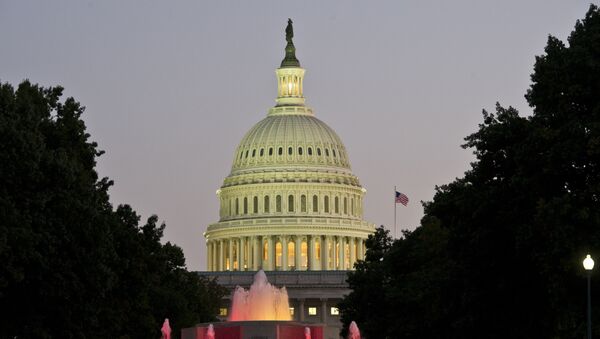 The US Congress building is seen at dusk on the eve of a possible government shutdown as Congress battles out the budget in Washington, DC, September 30, 2013. - Sputnik International