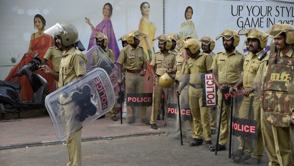 Policemen stand guard near the state secretariat anticipating protests following reports of two women of menstruating age entering the Sabarimala temple, one of the world's largest Hindu pilgrimage sites, in Thiruvananthapuram, Kerala, India, Wednesday, Jan. 2, 2019 - Sputnik International