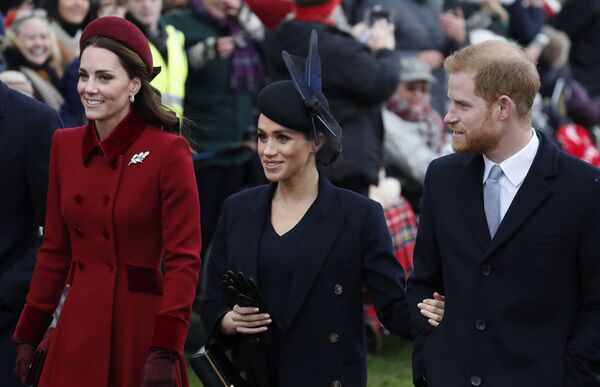 Britain's Kate, Duchess of Cambridge, left, Meghan Duchess of Sussex and Prince Harry, right, arrive to attend the Christmas day service at St Mary Magdalene Church in Sandringham in Norfolk, England, Tuesday, Dec. 25, 2018. - Sputnik International