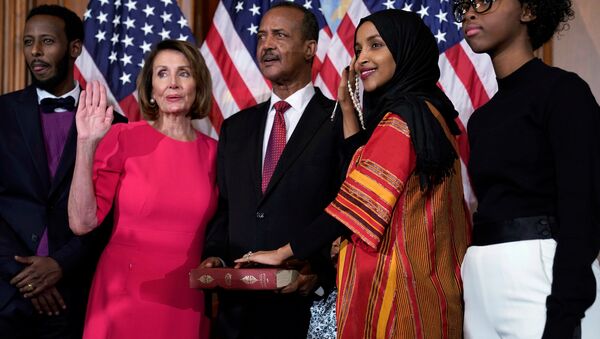 Rep. Ilhan Omar (D-MN) poses with Speaker of the House Nancy Pelosi (D-CA) for a ceremonial ceremonial swearing in picture on Capitol Hill in Washington, U.S., January 3, 2019. REUTERS/Joshua Roberts - Sputnik International
