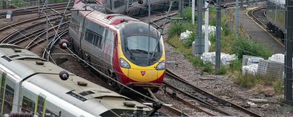 A Virgin train arrives at Euston station in London, on August 15, 2012 - Sputnik International