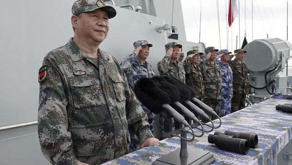 In this April 12, 2018 file photo released by Xinhua News Agency, Chinese President Xi Jinping speaks after reviewing the Chinese People's Liberation Army (PLA) Navy fleet in the South China Sea.  - Sputnik International