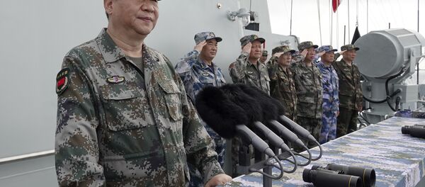 In this April 12, 2018 file photo released by Xinhua News Agency, Chinese President Xi Jinping speaks after reviewing the Chinese People's Liberation Army (PLA) Navy fleet in the South China Sea. - Sputnik International