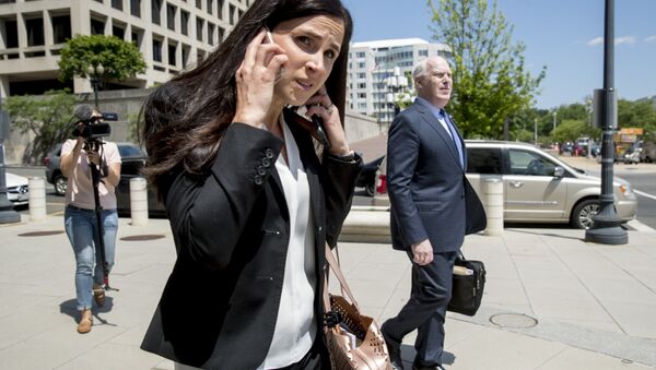 Attorneys Eric Dubelier, right, and Katherine Seikaly, left, representing Concord Management and Consulting LLC, walk out of federal court in Washington, Wednesday, May 9, 2018. - Sputnik International