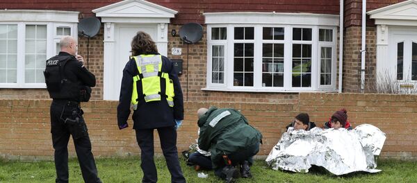 Police, Border Force and paramedics attend to migrants found following a search which was launched when an empty inflatable boat was found on Dungeness beach in Kent, England, Monday, Jan. 7, 2019. Police, Border Force and paramedics attend to migrants found following a search which was launched when an empty inflatable boat was found on Dungeness beach in Kent, England, Monday, Jan. 7, 2019. - Sputnik International