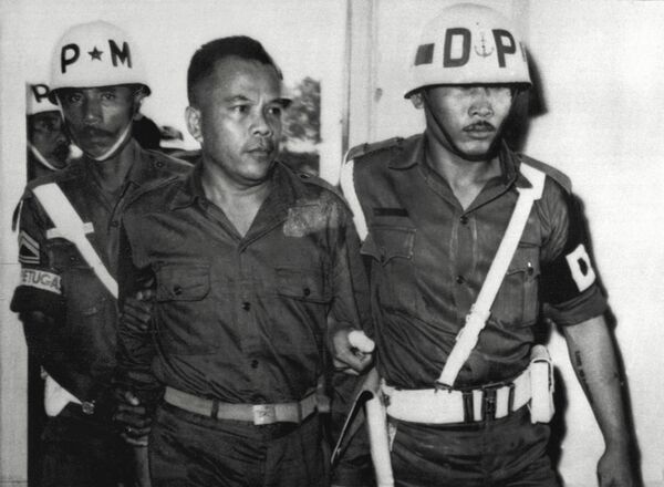 Colonel Untung Syamsuri is led away after his failed coup in Indonesia in 1965. He was later executed Colonel Untung Syamsuri is led away after his failed coup in Indonesia in 1965. He was later executed - Sputnik International
