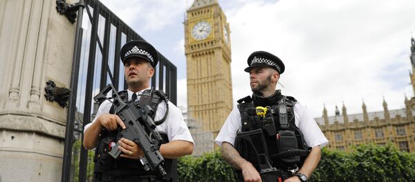Armed police patrol by the Houses of Parliament on June 16, 2017. Armed police patrol by the Houses of Parliament on June 16, 2017. - Sputnik International
