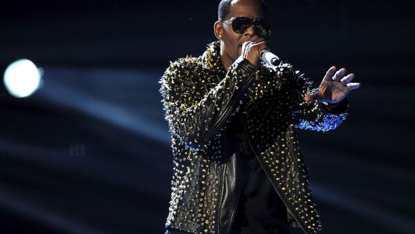 FILE - In this June 30, 2013, file photo, R. Kelly performs onstage at the BET Awards at the Nokia Theatre in Los Angeles. R. Kelly says the media are attempting to distort and destroy his legacy by reporting allegations that he sexually mistreats women. The R&B artist says in a statement Friday, May 4, 2018 that he's heartbroken by the accusations. - Sputnik International