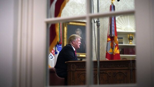 As seen from a window outside the Oval Office, President Donald Trump gives a prime-time address about border security Tuesday, Jan. 8, 2018, at the White House in Washington - Sputnik International