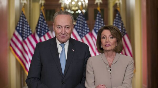Senate Minority Leader Chuck Schumer of N.Y., and House Speaker Nancy Pelosi of Calif., pose for photographers after speaking on Capitol Hill in response President Donald Trump's address, Tuesday, Jan. 8, 2019, in Washington - Sputnik International