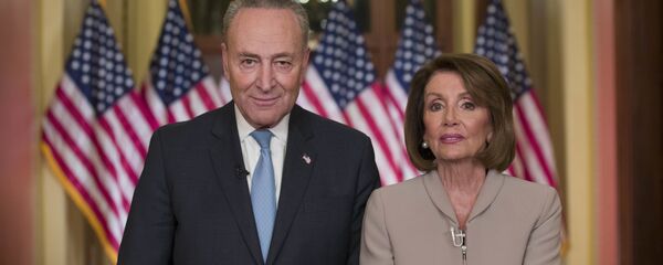Senate Minority Leader Chuck Schumer of N.Y., and House Speaker Nancy Pelosi of Calif., pose for photographers after speaking on Capitol Hill in response President Donald Trump's address, Tuesday, Jan. 8, 2019, in Washington - Sputnik International