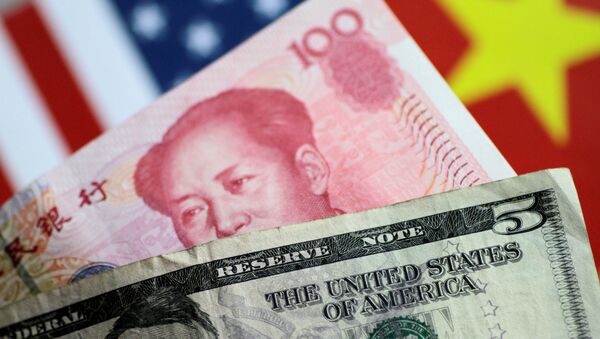 U.S. Dollar and China Yuan notes are seen in this picture illustration June 2, 2017 - Sputnik International
