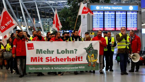 Duesseldorf Airport employees march through the main hall during a strike by German union Verdi, which called on security staff at Duesseldorf, Cologne and Stuttgart airports to put pressure on management in wage talks, in Duesseldorf, Germany January 10, 2019 - Sputnik International
