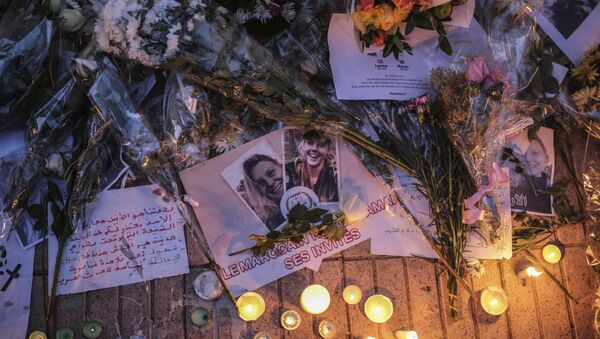 Flowers, candles and messages are laid during a vigil outside the Norwegian embassy in Rabat for two Scandinavian university students who were killed in a terrorist attack in a remote area of the Atlas Mountains, Morocco, Saturday, Dec. 22, 2018 - Sputnik International