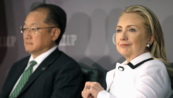 (File photo) World Bank President Jim Yong Kim, left, and Secretary of State Hillary Rodham Clinton wait to address the Gallup Evidence and Impact: Closing the Gender Data Gap conference in Washington, Thursday, July 19, 2012 - Sputnik International