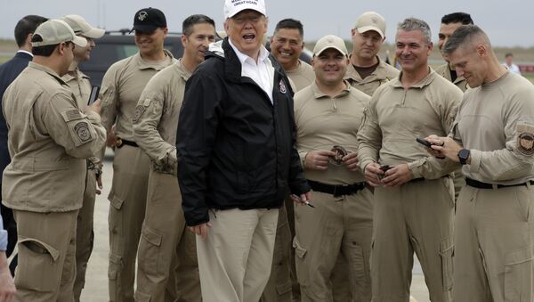 President Donald Trump turns as he talks to U.S. Customs and Border Protection officers at McAllen International Airport as he prepares to leave after a visit to the southern border, Thursday, Jan. 10, 2019, in McAllen, Texas - Sputnik International