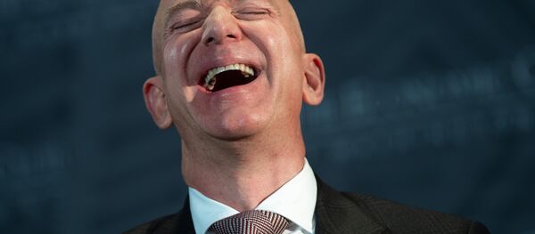 Jeff Bezos, founder and CEO of Amazon, laughs as he speaks during the Economic Club of Washington's Milestone Celebration event in Washington, DC, on September 13, 2018 - Sputnik International