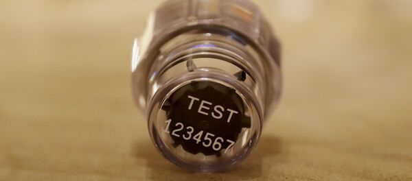 In this Dec. 12, 2016, file photo, an example of a sample bottle lid from the latest Berlinger Special BEREG-Kit for human urine doping testing lies posed for photographs in London. The Swiss manufacturer of the bottles used around the world to hold doping control samples says it is pulling out of the niche industry. Berlinger's withdrawal from the market poses a major headache for anti-doping agencies, who are now scrambling to find alternative suppliers - Sputnik International