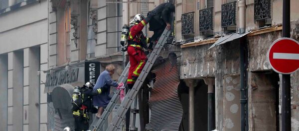Firemen work at the site of an explosion in a bakery shop in the 9th District in Paris Firemen work at the site of an explosion in a bakery shop in the 9th District in Paris - Sputnik International