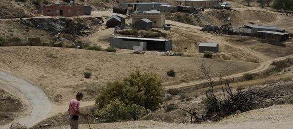 In this May 12, 2015 file photo, a Bedouin man walks through the village of Umm Al-Hiran in the Israeli Negev desert In this May 12, 2015 file photo, a Bedouin man walks through the village of Umm Al-Hiran in the Israeli Negev desert - Sputnik International