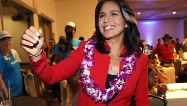 In this Nov. 6, 2018, file photo, Rep. Tulsi Gabbard, D-Hawaii, greets supporters in Honolulu. Gabbard has announced she’s running for president in 2020 - Sputnik International