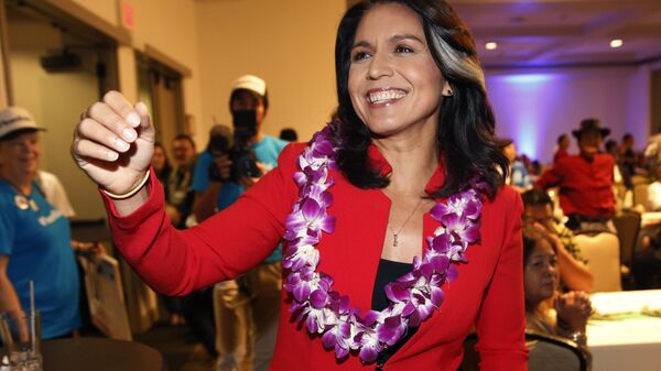 In this Nov. 6, 2018, file photo, Rep. Tulsi Gabbard, D-Hawaii, greets supporters in Honolulu. Gabbard has announced she’s running for president in 2020 - Sputnik International