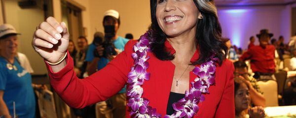 In this Nov. 6, 2018, file photo, Rep. Tulsi Gabbard, D-Hawaii, greets supporters in Honolulu. Gabbard has announced she’s running for president in 2020 In this Nov. 6, 2018, file photo, Rep. Tulsi Gabbard, D-Hawaii, greets supporters in Honolulu. Gabbard has announced she’s running for president in 2020 - Sputnik International