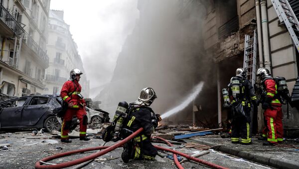 Firefighters extinguish a fire after the explosion of a bakery on the corner of the streets Saint-Cecile and Rue de Trevise in central Paris on January 12, 2019. - Sputnik International