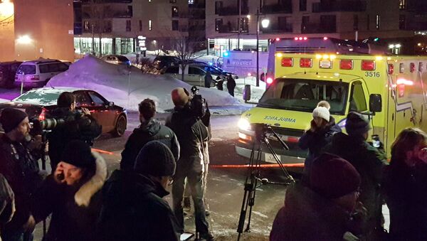 An ambulance is parked at the scene of a fatal shooting at the Quebec Islamic Cultural Centre in Quebec City, Canada - Sputnik International