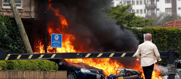 Cars are seen on fire at the scene where explosions and gunshots were heard at the Dusit hotel compound, in Nairobi, Kenya January 15, 2019 Cars are seen on fire at the scene where explosions and gunshots were heard at the Dusit hotel compound, in Nairobi, Kenya January 15, 2019 - Sputnik International