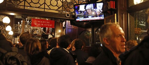 Drinkers watch a television screen in the Red Lion public house on Whitehall, as it shows Britain's Prime Minister Theresa May speaking in the House of Commons in London on January 15, 2019, before MPs vote on the government's Brexit deal Drinkers watch a television screen in the Red Lion public house on Whitehall, as it shows Britain's Prime Minister Theresa May speaking in the House of Commons in London on January 15, 2019, before MPs vote on the government's Brexit deal - Sputnik International