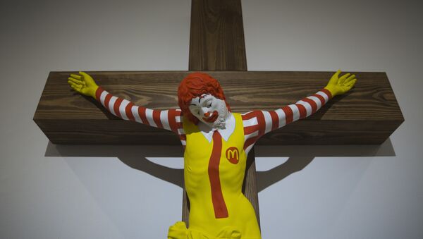 An artwork called McJesus, which was sculpted by Finnish artist Jani Leinonen and depicts a crucified Ronald McDonald, is seen on display as part of the Haifa museum's Sacred Goods exhibit, in Haifa, Israel, Monday, Jan. 14, 2019 - Sputnik International